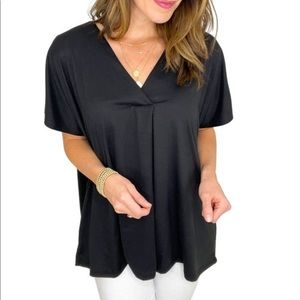 Entro elevated black top that has never been worn.